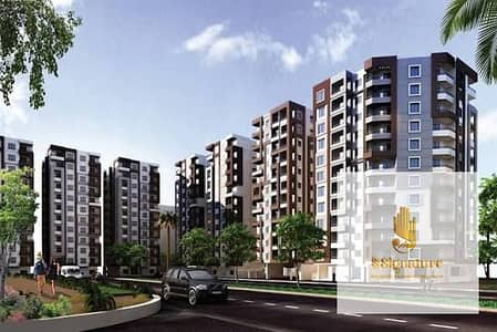 Semi-finished apartment for sale in the Green Hills Compound (Arab Contractors) on the Autostrad, Nasr City; immediate delivery and an open view.