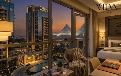 A 80-square-meter hotel unit—fully finished and furnished—is for sale at the Triumph View Hotel, featuring a direct view of the Pyramids