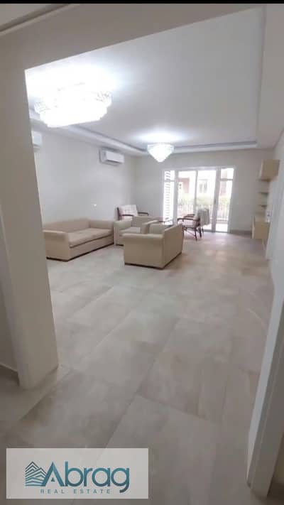 Apartment for rent (158 sqm) featuring two bedrooms, a kitchen, and air conditioning. Located in the October Plaza Sodic compound, opposite Mountain V