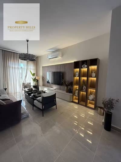 Old Price Offer in Ora New Cairo: 2-bedroom fully finished apartment with ACs and kitchen, 5% down payment only, 10-year installments, direct landscap