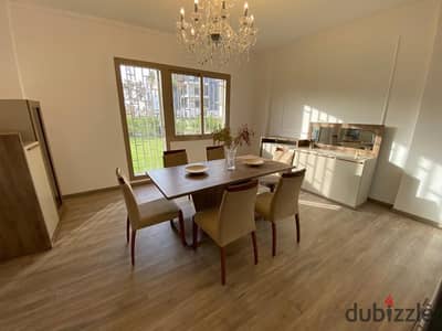 Furnished apartment with private garden for rent in Courtyard Aeon Marakez near Mall of Arabia, modern furniture, prime location & top luxury living.