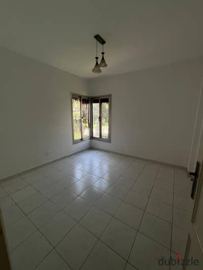 90 sqm apartment for rent in Al Rehab; ground floor with a private garden, in a prime location near Services.
