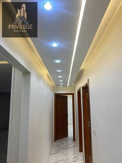 Apartment for rent in Maadi Dunes compound, modern finishing, with 2 balconies overlooking the fountain, and a private garage space next to Modern Academy