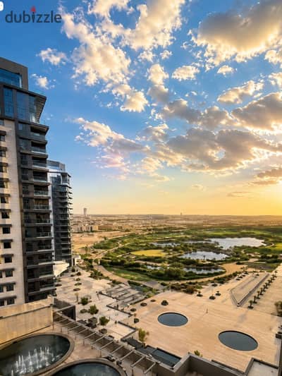 3-bedroom corner apartment with a landscape view for sale at ZED Towers, Sheikh Zayed; finished and equipped with a kitchen and air conditioning.