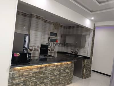 Furnished two-bedroom apartments with a living room available for long-term rent in Hurghada (Al-Kawthar district), opposite Al-Masry Hospital.