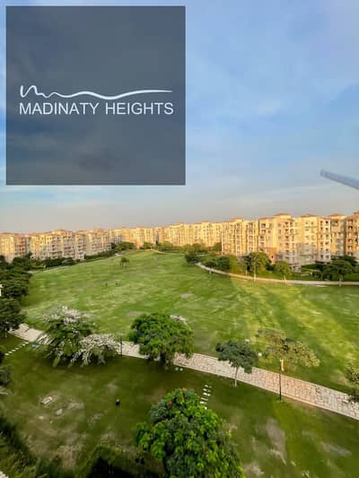 Apartment on the largest wide garden in Madinaty  ​Apartment 175m for sale in Madinaty ultra-super-lux finishing Apartment close to Metro Market and open air mall special finishing entirely imported floors of the apartment hdf completely imported Turkish high-quality wood interior doors main apartment door is armored fantastic wooden cladding