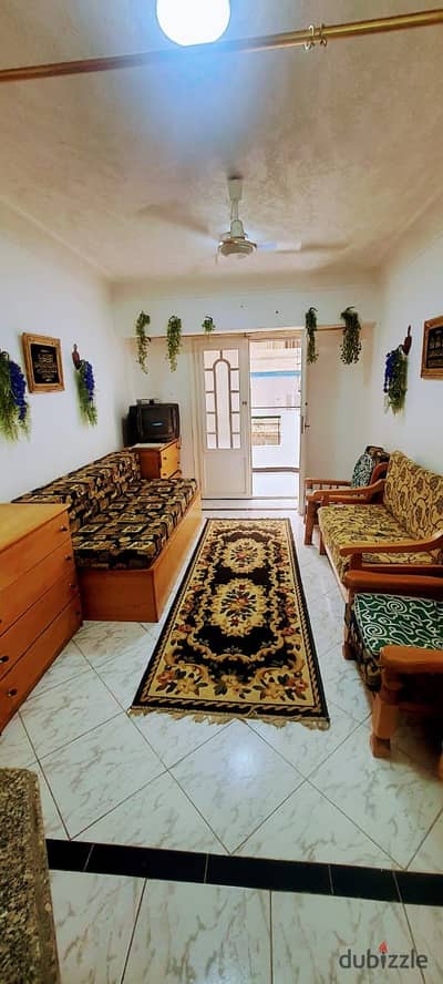 Apartment with modern furnishings and appliances for sale in Al-Ajami, Palm Beach, next to services, suitable for living and good investment