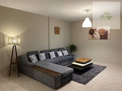 Furnished apartment for rent in Al-Rehab with two bedrooms on the ground floor with a garden