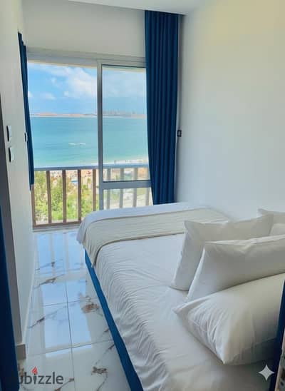  Luxury Hotel-Style Apartment – ​​Direct Seafront in Al-Maamoura 