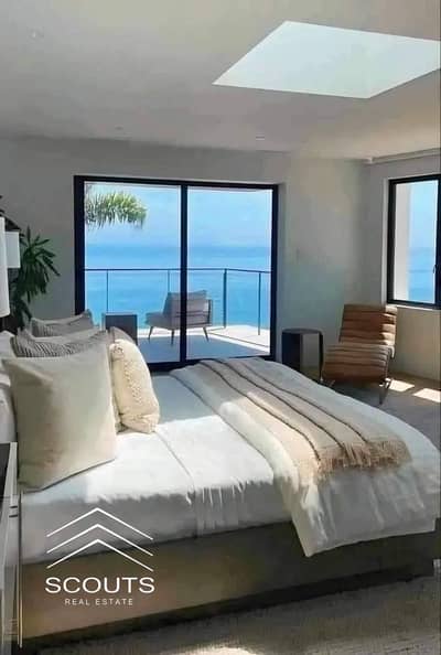 Chalet for Sale with Immediate Delivery, Featuring a Prime Sea and Lagoon View in Mazarine, New Alamein City, Next to Porto. Fully Finished. Mazarine
