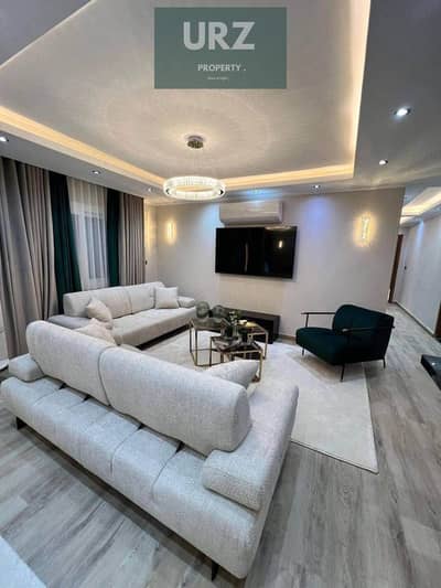 Apartment for sale in Sarai 12 years installments and 50% discount located on Center Park on Suez Road next to Madinaty near AUC