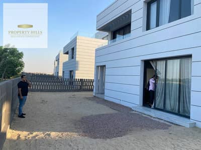 Twin house for sale in Al Burouj compound, available for immediate handover, fully finished, with payment plan options.