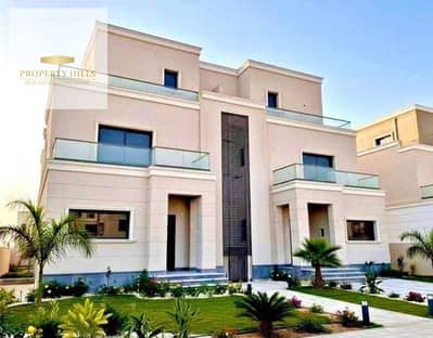 Town Corner Villa with a garden of 205 meters, featuring a distinctive view of the landscape, located on the Dahshur link next to the Smart Village