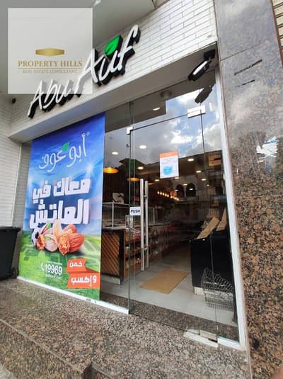 A commercial space for sale, currently rented for 130,000 EGP with a long-term lease. It's on the ground floor, has air conditioning, and is located on Nasr Street, just steps from Golden Square and near Sadat Axis. Installment payment options are availab