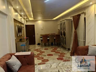 Apartment for sale in Misr Al-Tayaran Housing Buildings, 100 meters, elevated ground floor, secured with iron, 3 bedrooms, 1 bathroom, kitchen, and a