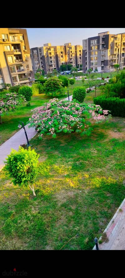 For sale, a 150 square meter apartment on the ground floor with a garden view in Dar Misr Compound, Area 16, Sheikh Zayed
