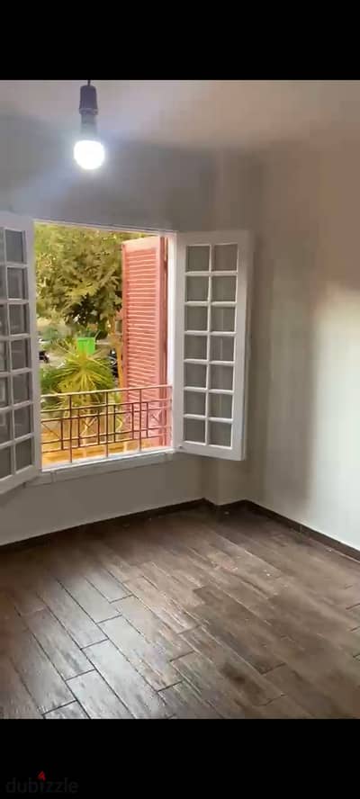 Apartment for rent with air conditioning, private garden, Opera City Compound, Sheikh Zayed