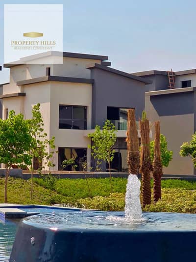 Villa available for immediate handover in Creek Town compound, Al Rehab, featuring a prime view of the lakes.