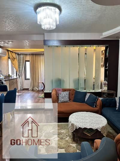 180-square-meter apartment with a garden view for sale in the Ashgar Darna compound; includes a kitchen and a dedicated parking space.