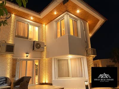 Luxury 4BR Hotel-Furnished Villa in Al Rabwa Compound, Sheikh Zayed. Features a large private garden, pool, and close proximity to Arkan Plaza/ 18K