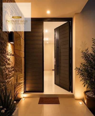 **Luxury Villa for Sale with a Stunning American-Style Design | Prime Location Near Mivida & Palm Hills**