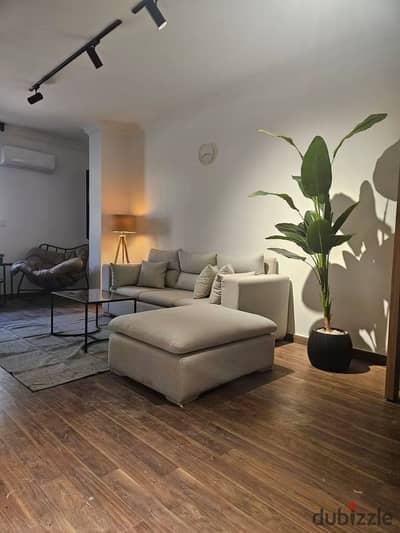 For sale, a finished apartment with a clear garden view, complete with utilities.