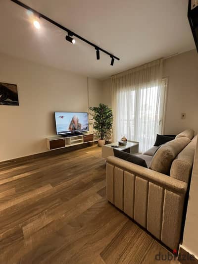 Furnished apartment for rent in the newest phase of Madinaty (B12); features extra-super-deluxe finishes and is located close to amenities.