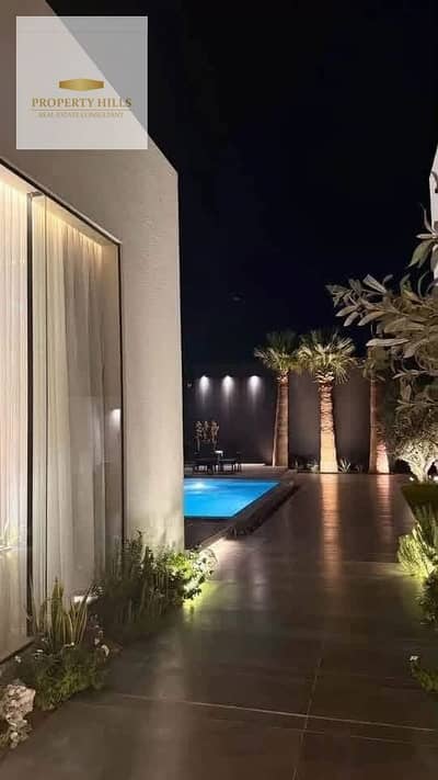 Villa for sale in Hyde Park Compound, featuring a stunning view overlooking the water features, for only 15 million EGP cash.