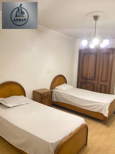 For rent, a furnished hotel apartment in the Future Towers compound on the Autostrad road and directly in front of Daghla Maadi, a prime location next to services, an upscale secured compound 24 hours a day, private garage, 20 minutes to Helwan University