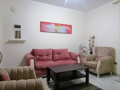 Furnished apartment for rent in Badr El-Din Towers – Sheikh Zayed, Ground Floor, 70 meters fully air-conditioned