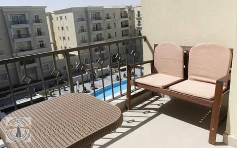 An exceptional apartment in Mivida compound, featuring 2 bedrooms and 2 bathrooms; fully equipped and located directly overlooking the pool