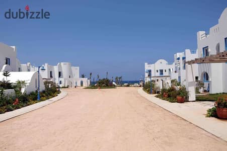 Twin house for sale, just steps from the lagoon; fully finished and Ready To Move, located at Mountain View North Coast, Ras El Hekma.