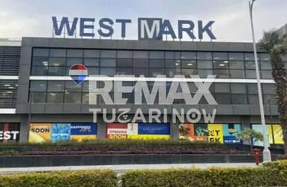Own your shop now on the 26th of July directly in front of Nile University located in a strategic area in West Cairo near Swan Lake and Palm Hills