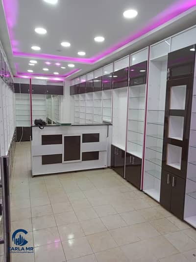 Pharmacy for sale, located on Hassan Mohamed Street—a side street off Al-Haram Street and King Faisal Street.  The property is situated on a corner an
