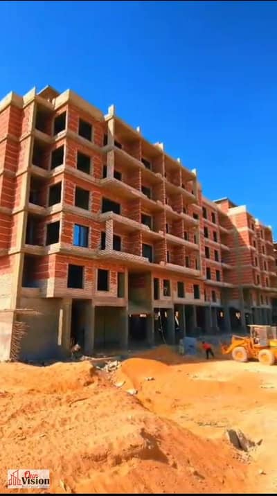 For sale inside a compound in Sheikh Zayed 2 rooms on Al-Nuzha Street remaining installments for 7 years including Badia Garage