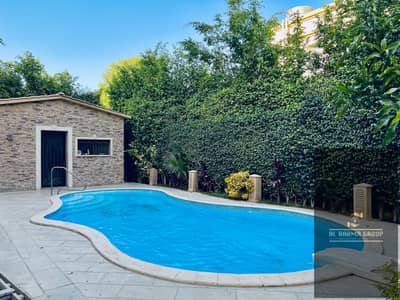 Villa for sale in the heart of Al Rehab. Features select finishes and a premium layout; includes a swimming pool, a great view, and a private garden.