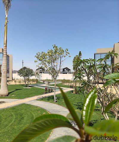 Corner townhouse for sale in Gates Privé – immediate delivery; features a 155m² garden and a 100m² roof terrace.
