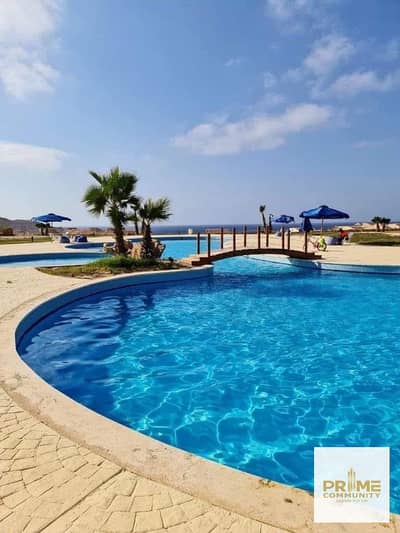 A ground-floor chalet 124 sqm with a private garden. in a prime location  direct views to the swimming pool and the sea in Coral hills Ras EL Hikma