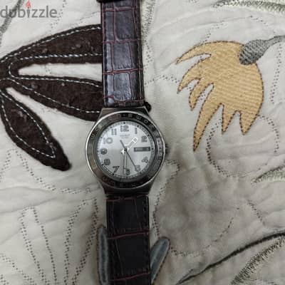 ساعه swatch بني . . .