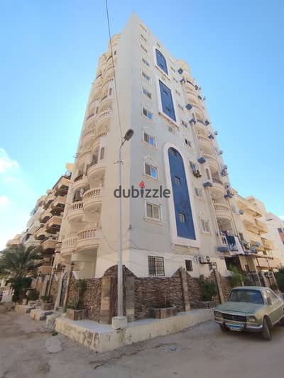 Apartment for sale at kilometer 21, Al Nakheel Beach, minutes to the sea and markets, suitable for residency and good investment, fully equipped with facilities.
