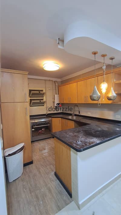 Apartment for rent, ground floor with a 150m garden, 100m garden, with kitchen, first row on the axis, close to Al-Khamail Gate, Sheikh Zayed