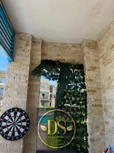 Chalet for sale in Ain Sokhna, 76 sqm + 25 sqm garden. Ultra-super-lux finish, fully furnished and equipped with appliances; features sea and pool vie