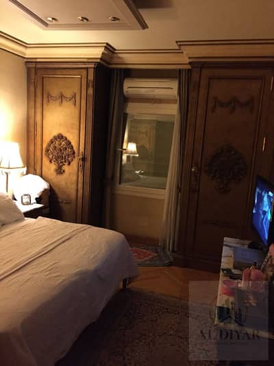 Apartment for sale in one of the finest side streets off Midan Al-Masaha in Dokki; comes fully furnished and equipped with appliances.