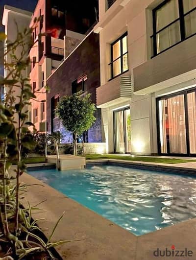For quick sale, duplex with a private swimming pool, immediate delivery, furnished in Trio Gardens compound in the Fifth Settlement, next to Palm Hills.