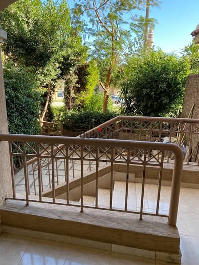 Ground-floor apartment with a garden for rent in Madinaty (B3 zone); 100 sqm interior space plus a 50 sqm private garden, featuring a garden view.