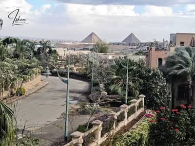 Wake up to breathtaking views of the Pyramids and the lake from 75 meters high! A luxury penthouse in City View—just 2 minutes from the Grand Egyptian