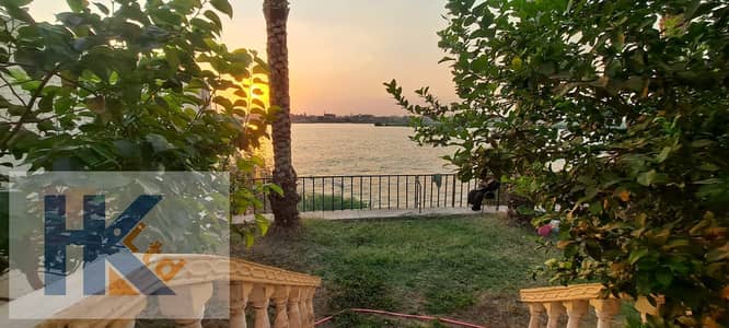 Villa for Sale on the Nile with a Large Garden, Fruit Trees, Plants, Vegetables, Parking for 4 Cars, Luxury, Peace, Relaxation & Investment.