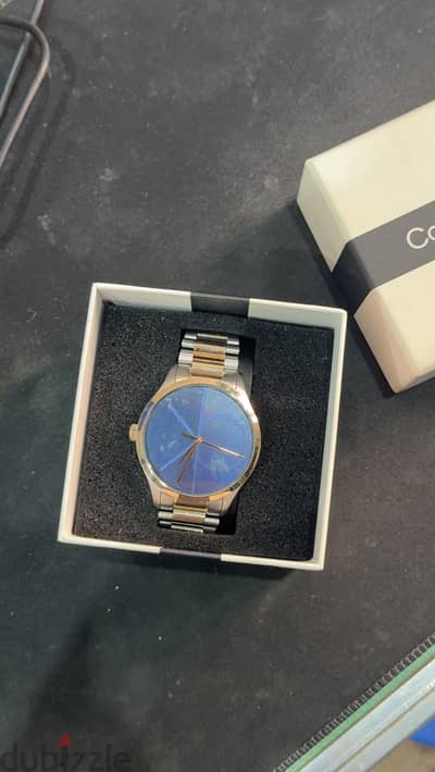 CALVIN KLEIN ICONIC UNISEX’S BLUE DIAL TWO TONE STAINLESS STEEL WATCH