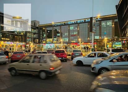 Ground floor shop for sale, ready for immediate occupancy, opposite the American University, with payment plans available over an extended period.