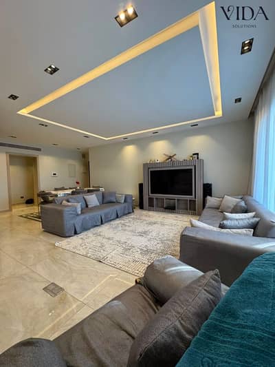 Penthouse for sale in Aeon Marakez compound 6th of October City features a pool and landscape view